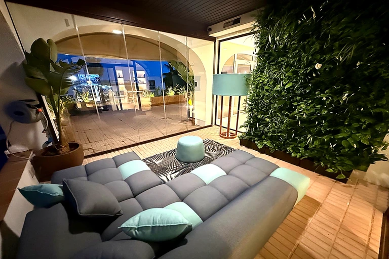 Terrace lounge at MGP Properties real estate office in Marina Santa Eulalia Ibiza where clients are welcomed.